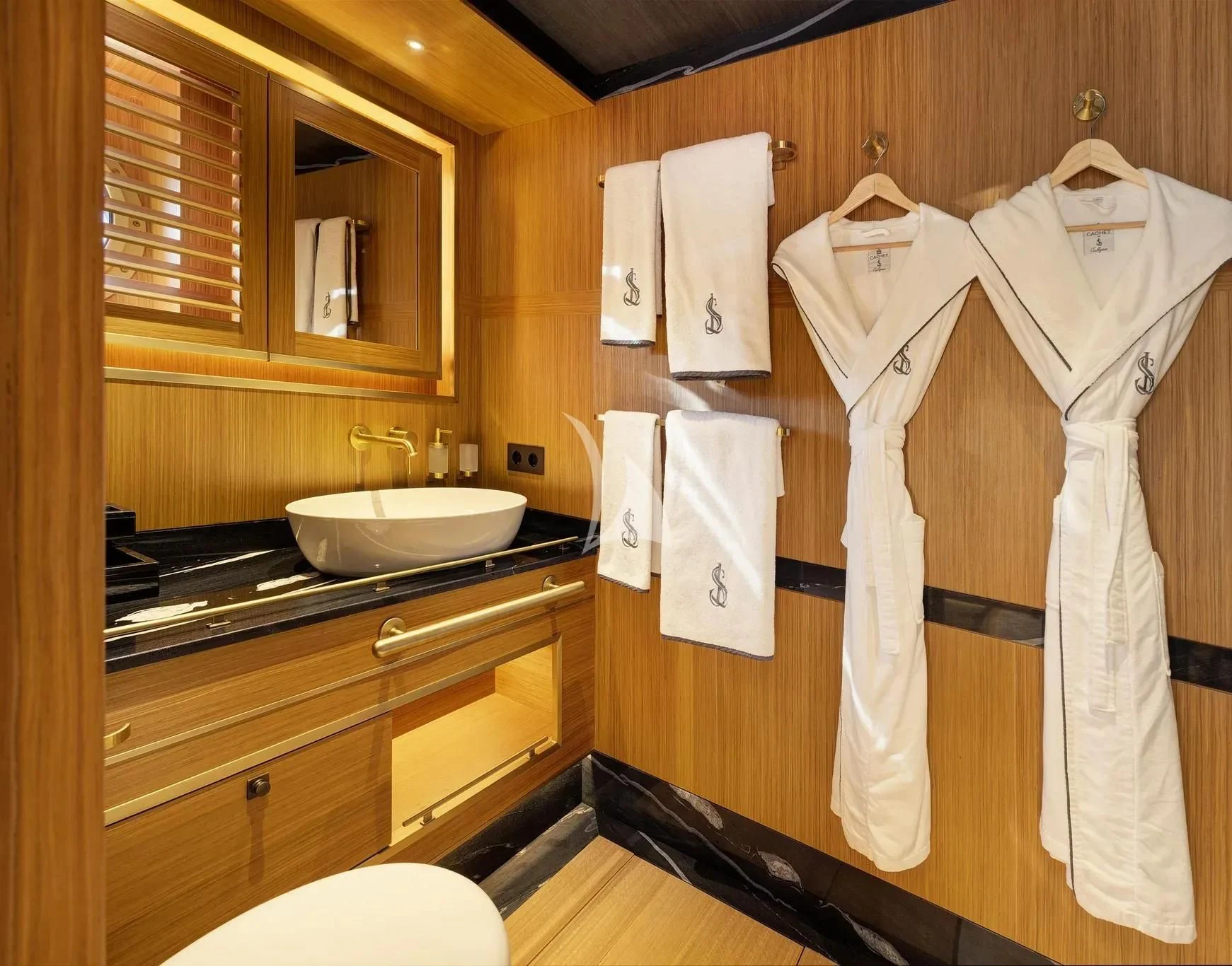 a bathroom with towels on the wall aboard SALLYNA Yacht for Sale