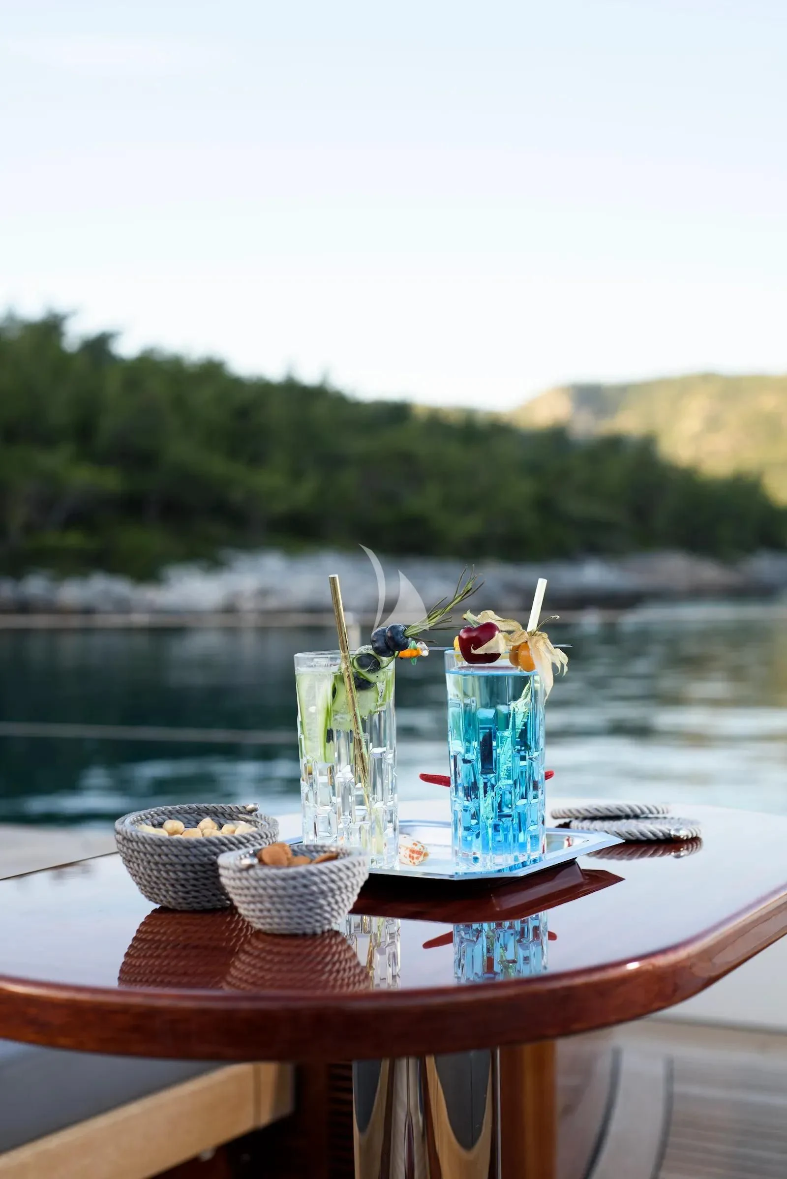 a table with flowers in a vase aboard SALLYNA Yacht for Sale