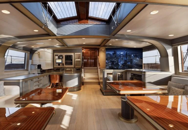 a large room with a wood floor and a large window aboard SALLYNA Yacht for Sale
