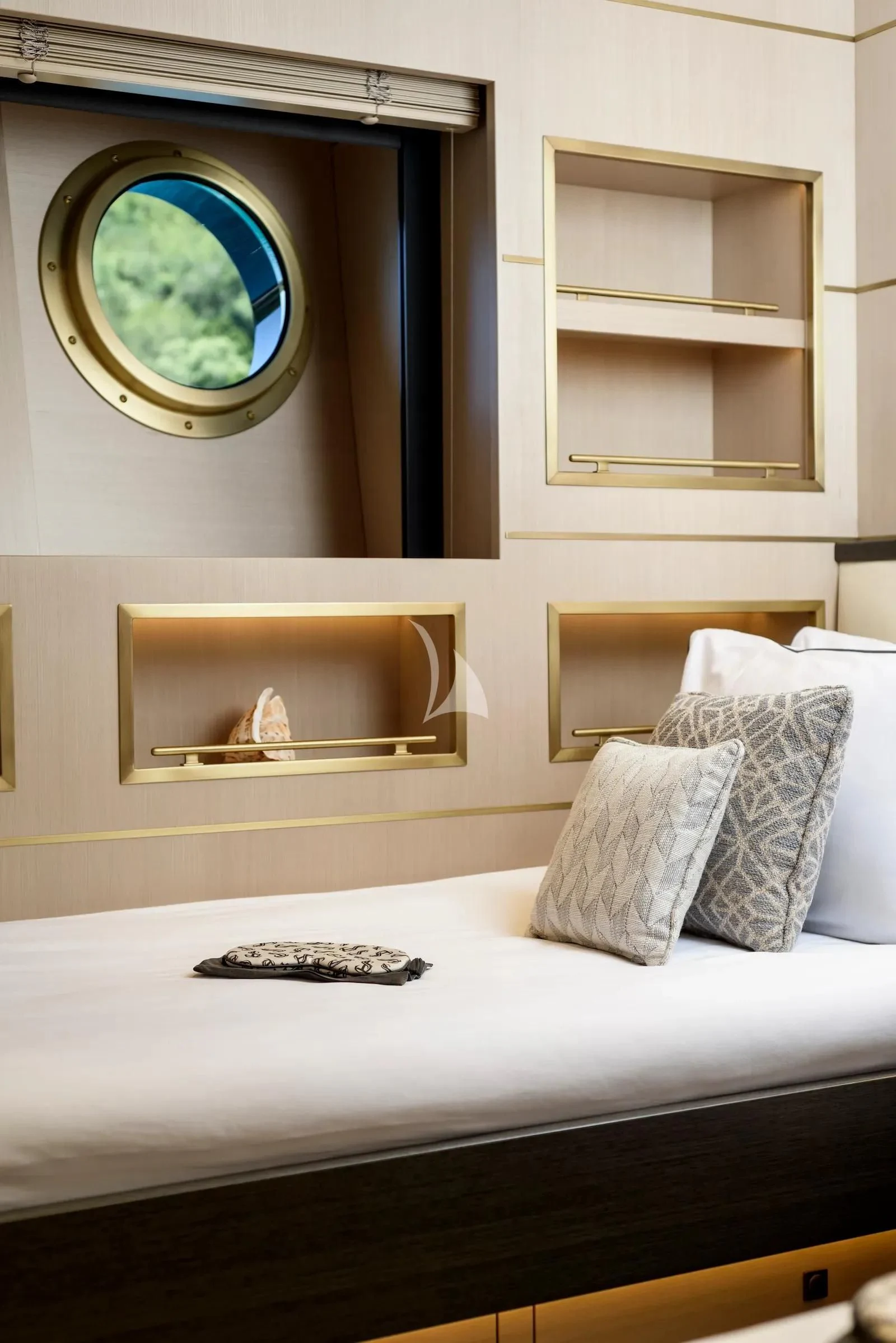 a bed with a mirror above it aboard SALLYNA Yacht for Sale