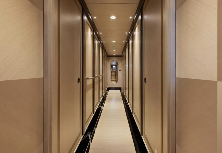 a hallway with a metal railing aboard SALLYNA Yacht for Sale