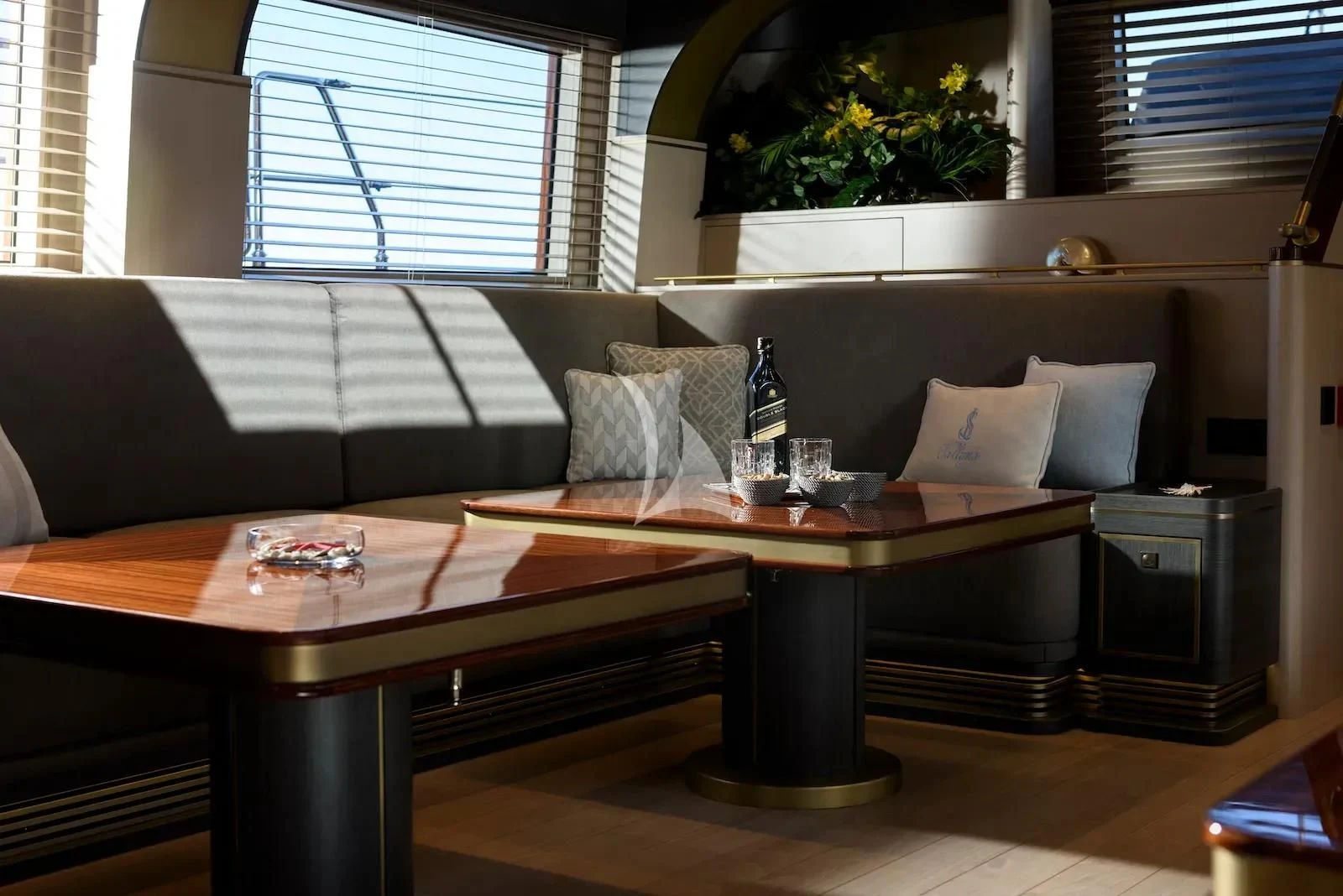 a living room with a couch and coffee table aboard SALLYNA Yacht for Sale