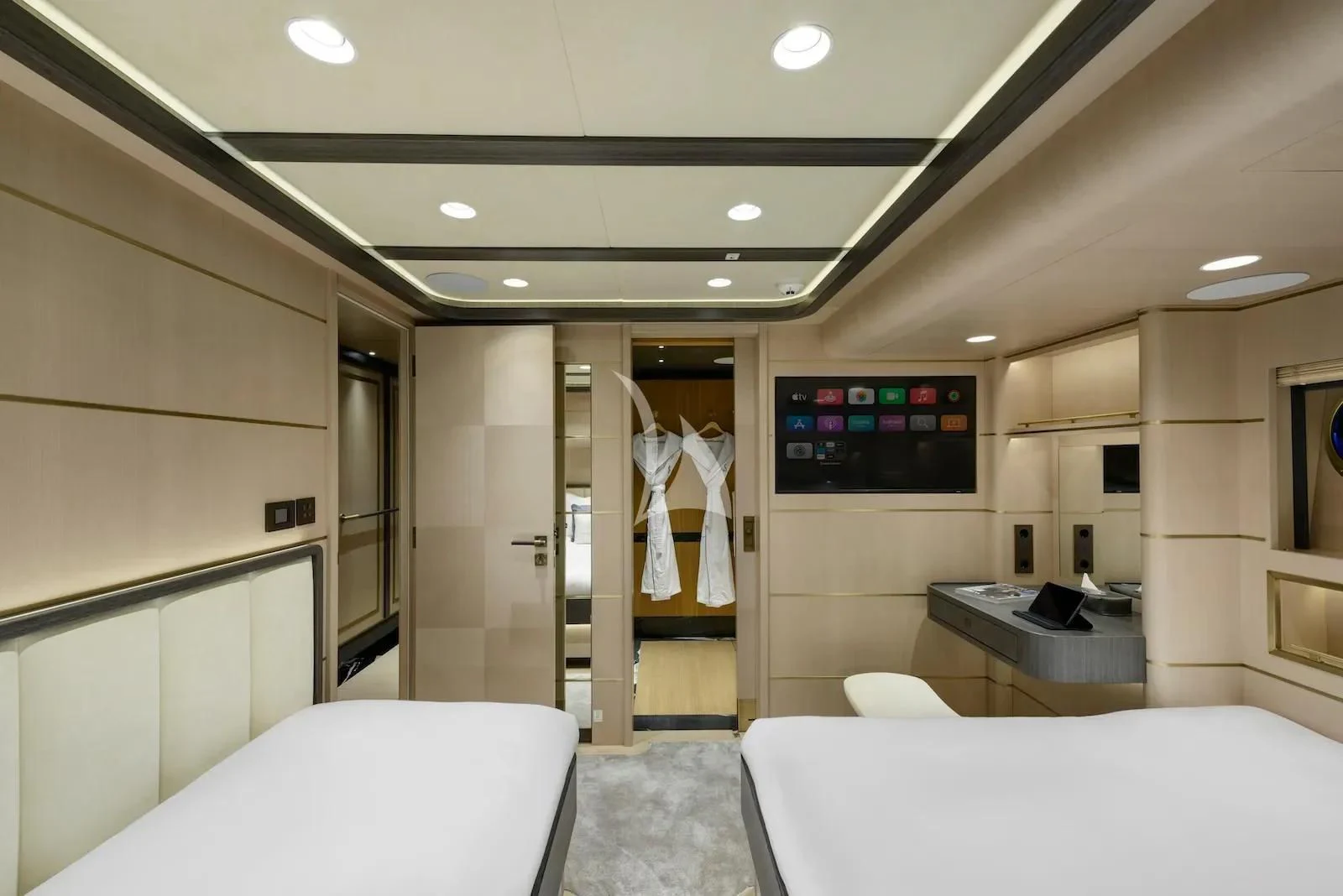 a room with a bed and a television on the wall aboard SALLYNA Yacht for Sale