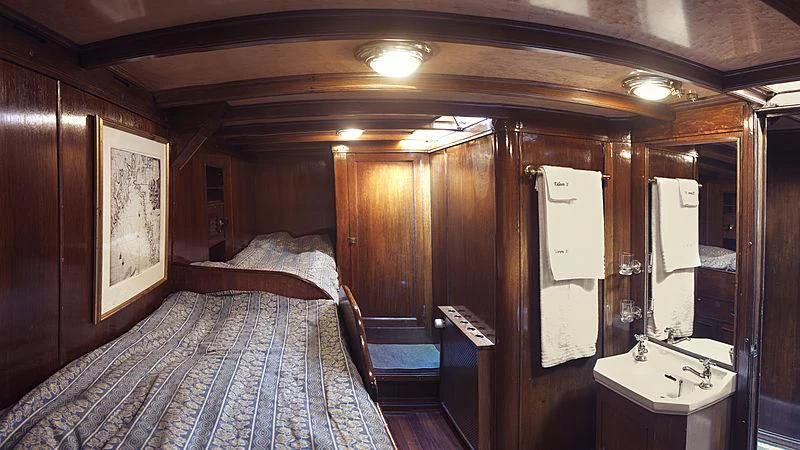 a bed in a room aboard EILEEN II Yacht for Sale