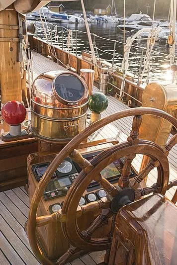 a wooden steering wheel aboard EILEEN II Yacht for Sale