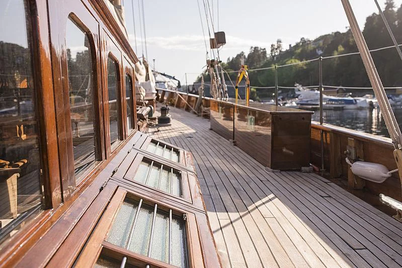 a deck with a view of the water and a dock aboard EILEEN II Yacht for Sale