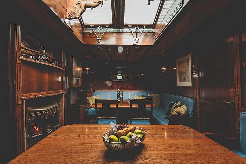a room with a table and a bowl of fruit on a table aboard EILEEN II Yacht for Sale