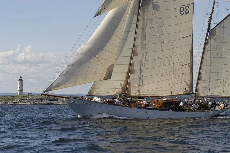 a sailboat with people on it aboard EILEEN II Yacht for Sale