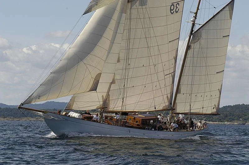 a large boat with people on it aboard EILEEN II Yacht for Sale