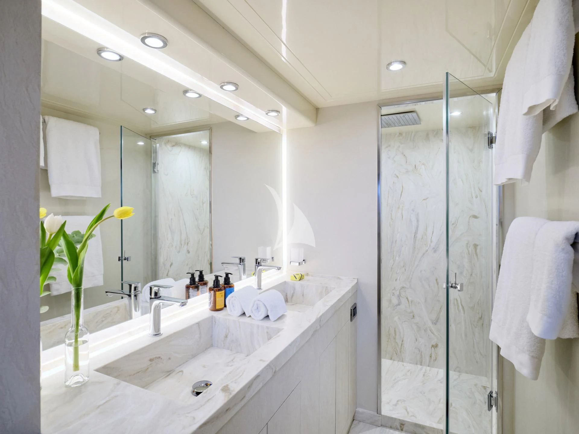 a bathroom with a sink and a shower aboard MANTRA Yacht for Sale