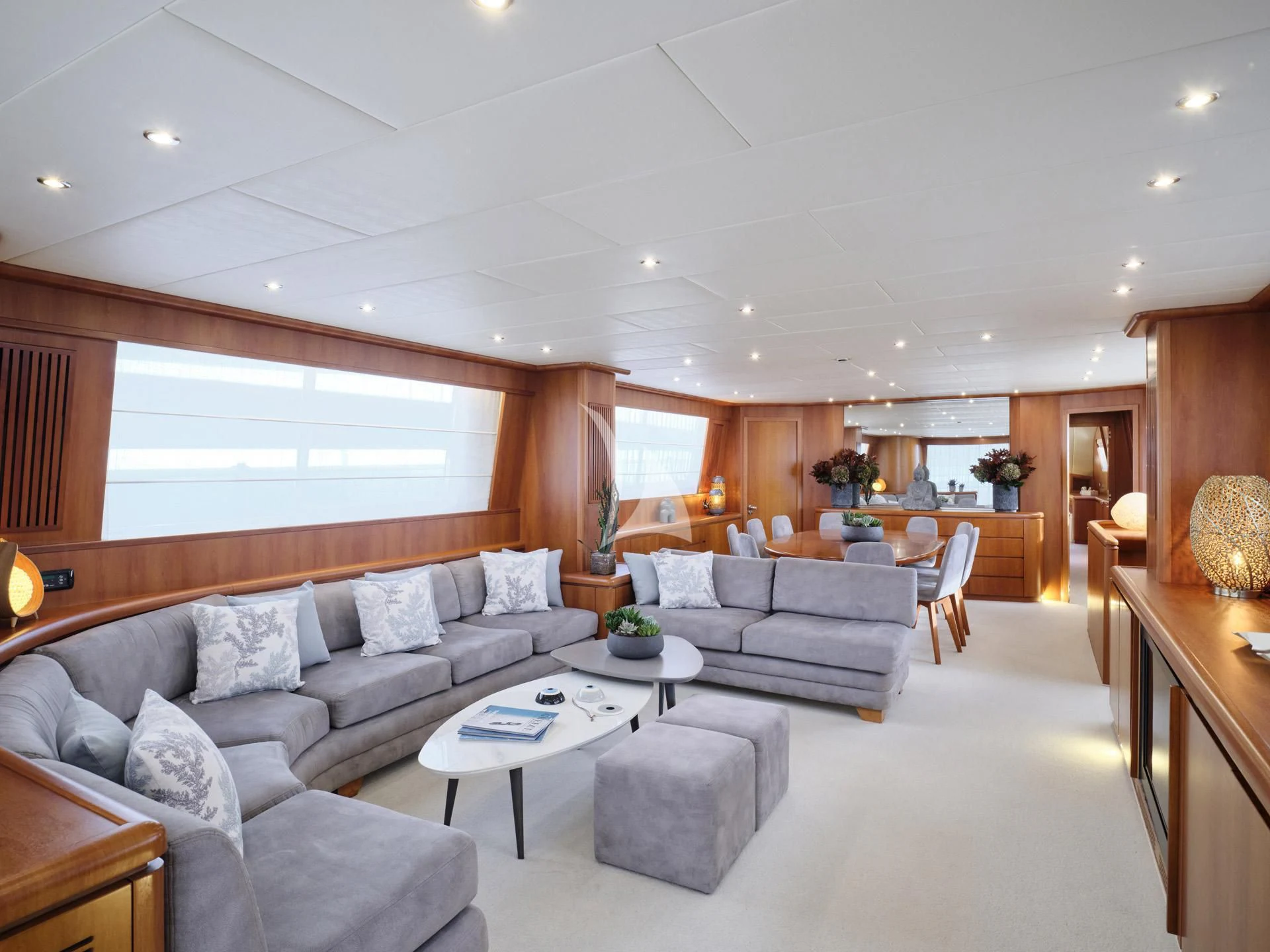 a living room with a couch and a table aboard MANTRA Yacht for Sale