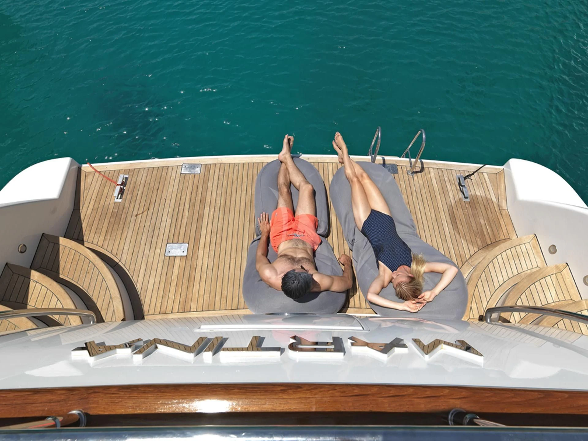 a group of people on a boat aboard MANTRA Yacht for Sale