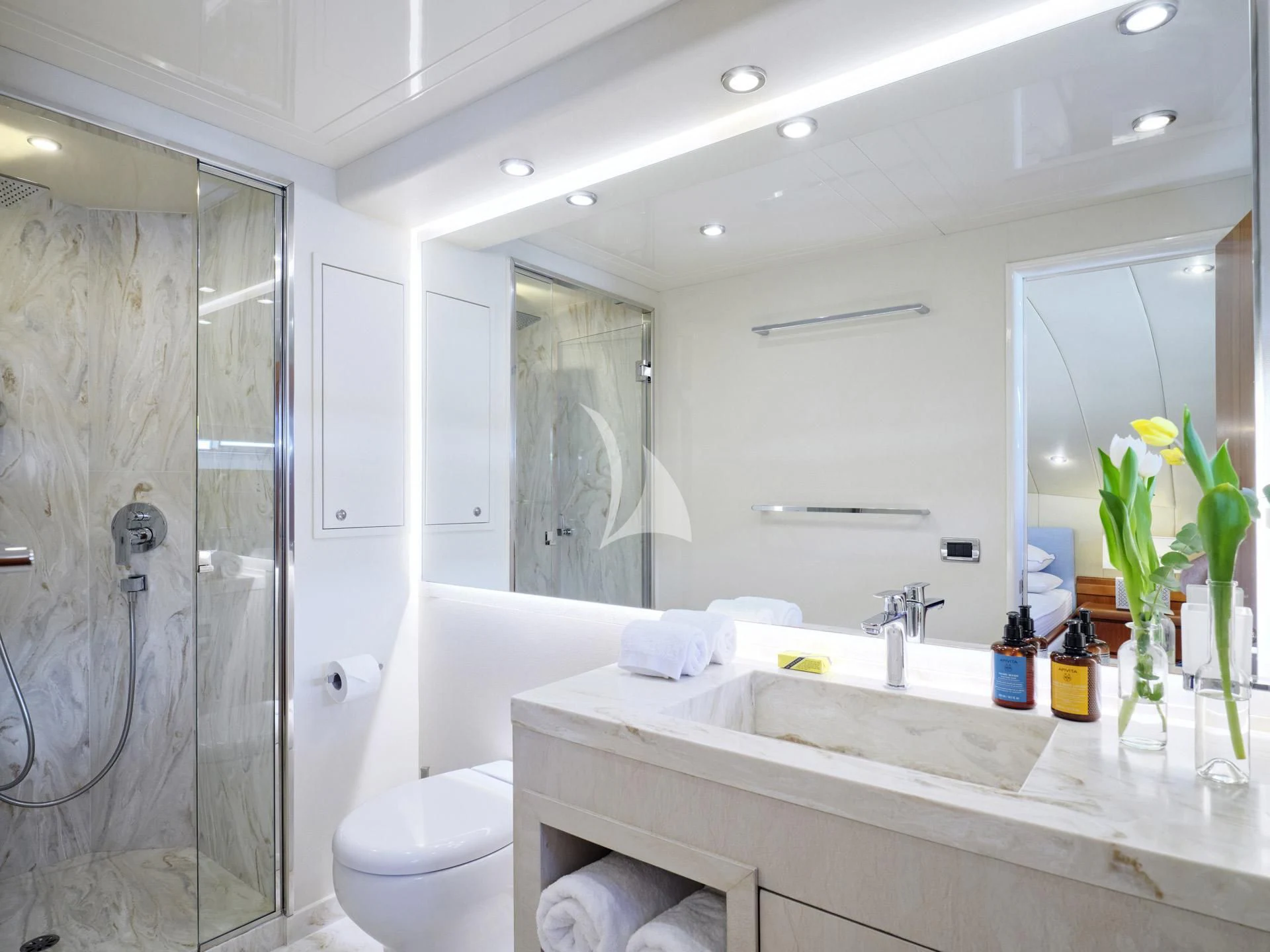 a bathroom with a glass shower aboard MANTRA Yacht for Sale