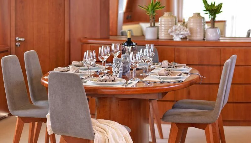 a table set for dinner aboard MANTRA Yacht for Sale