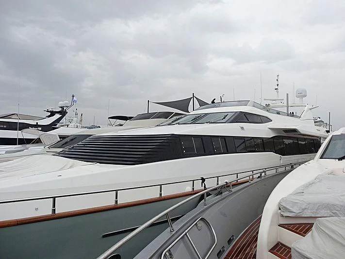 a yacht docked at a pier aboard MANTRA Yacht for Sale