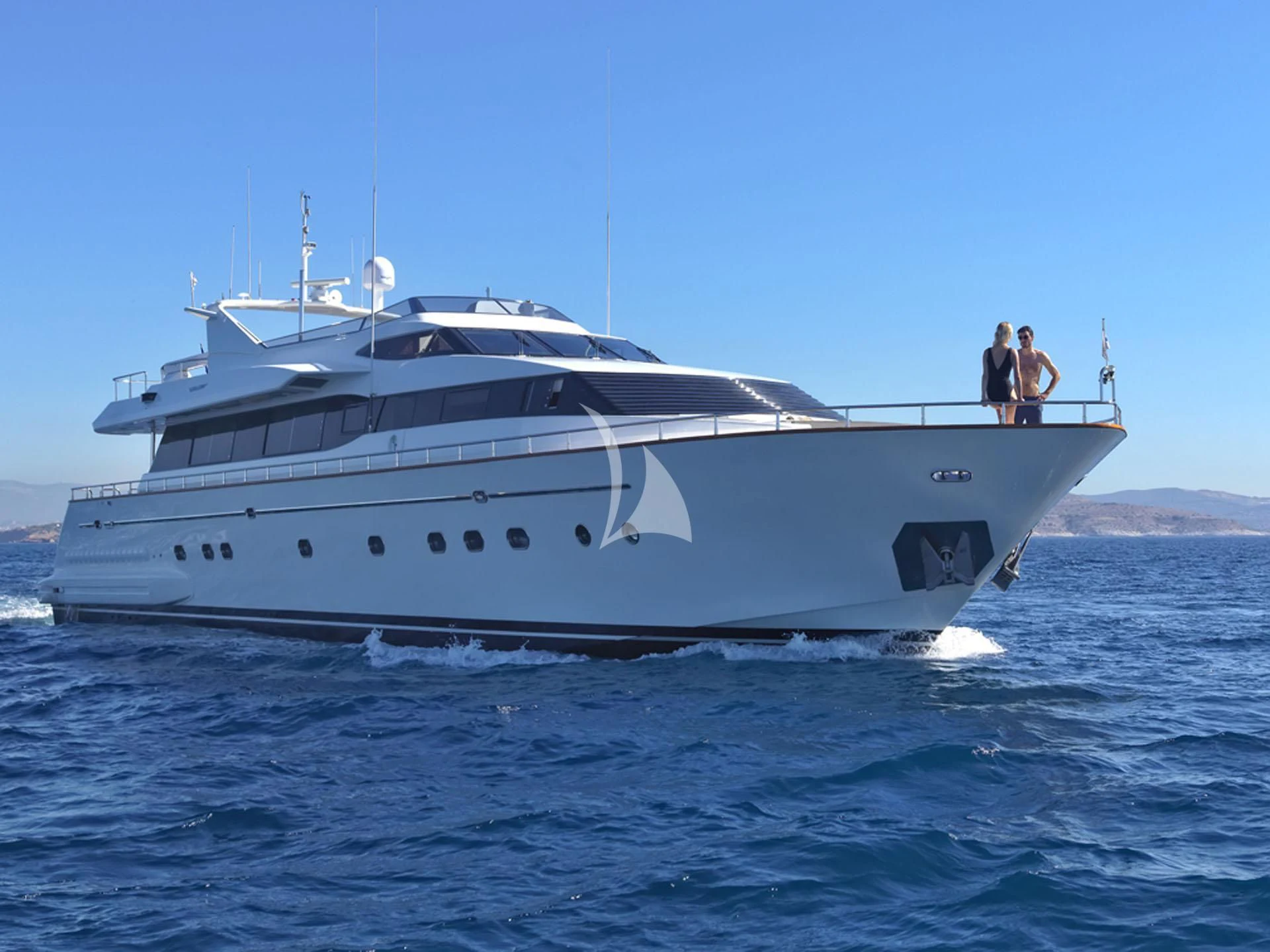 a couple of people on a boat aboard MANTRA Yacht for Sale