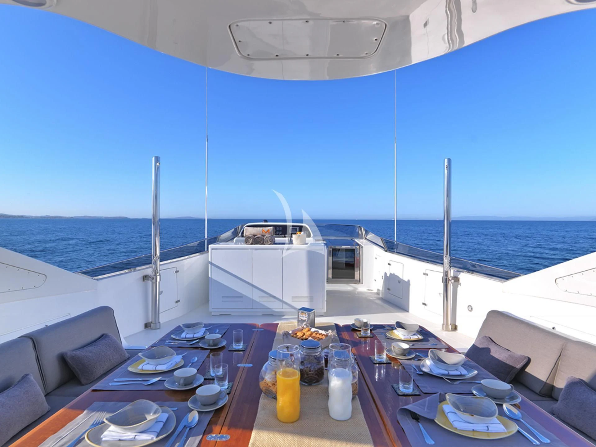 a large ship on the water aboard MANTRA Yacht for Sale