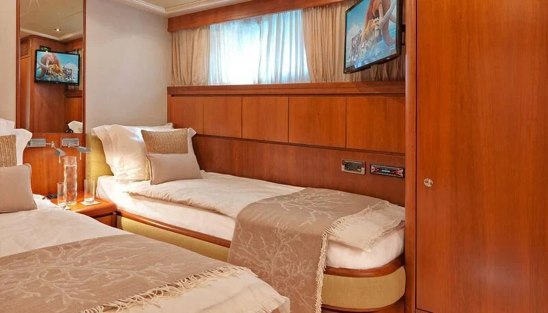 a room with two beds aboard MANTRA Yacht for Sale