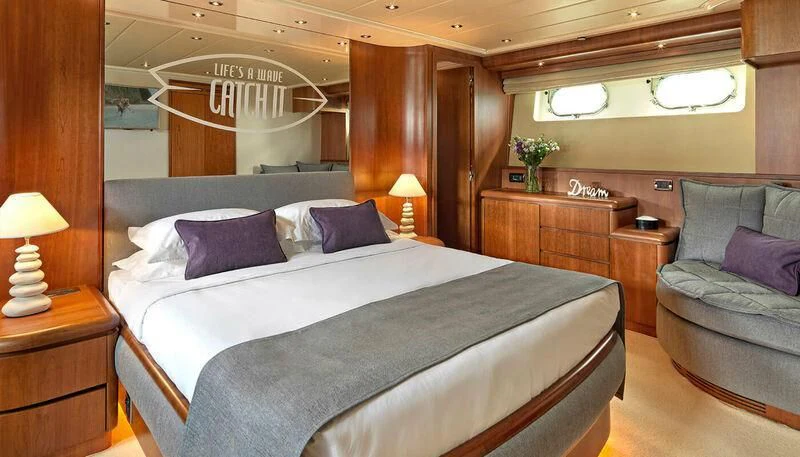 a bed in a room aboard MANTRA Yacht for Sale