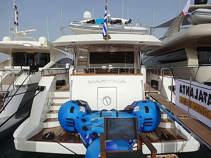 a boat with a blue and white boat on it aboard MANTRA Yacht for Sale
