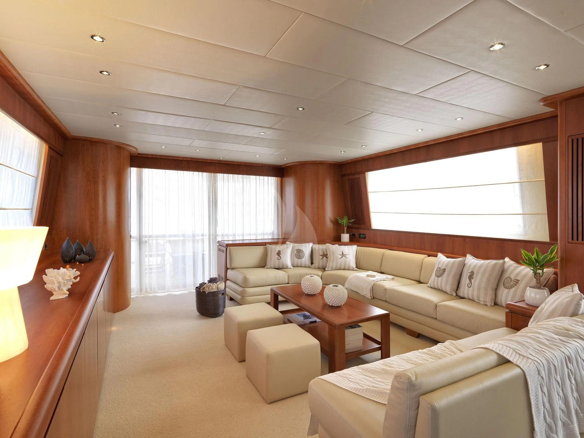 a living room with a couch and a table aboard MANTRA Yacht for Sale