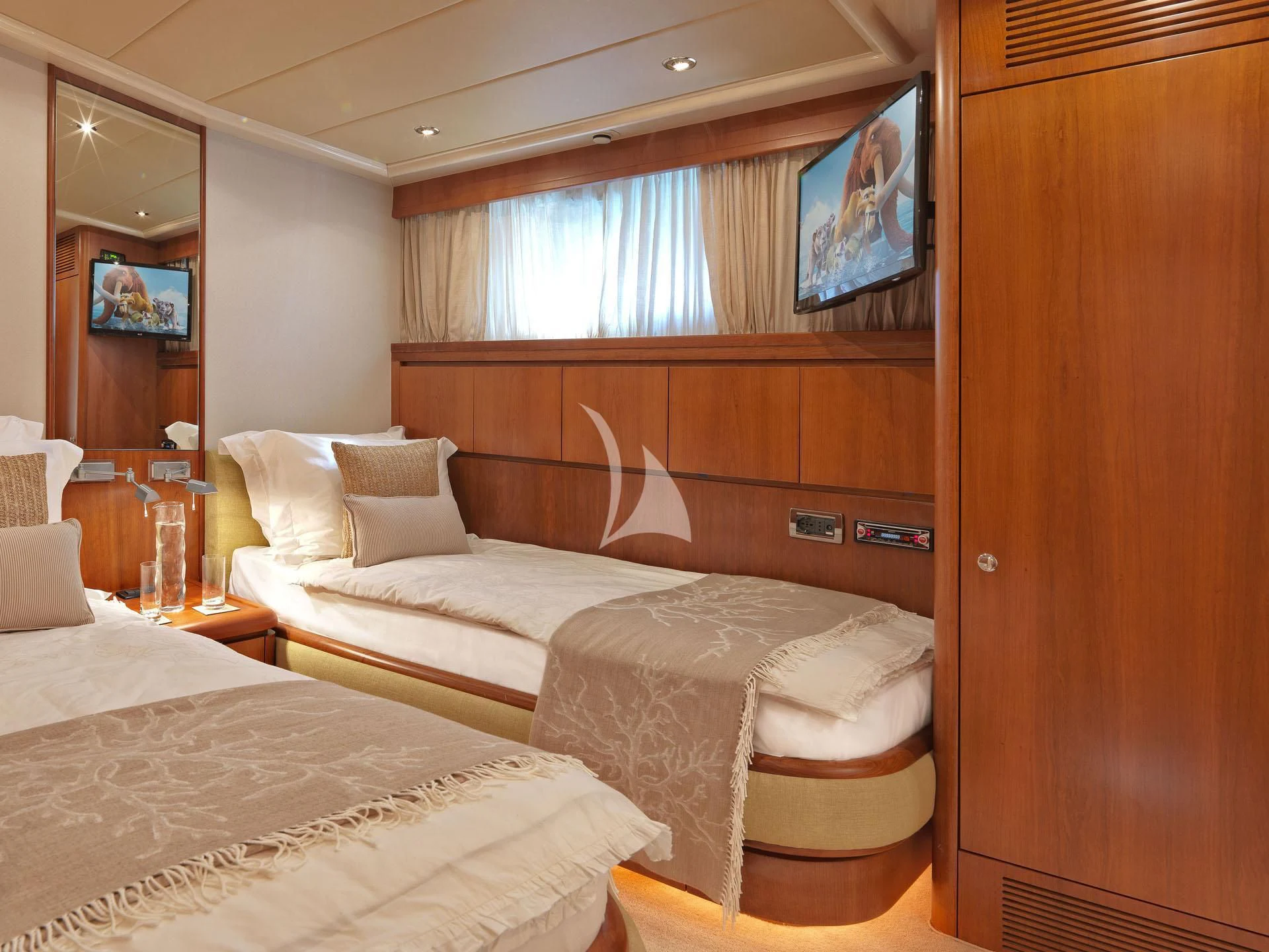 a room with two beds aboard MANTRA Yacht for Sale