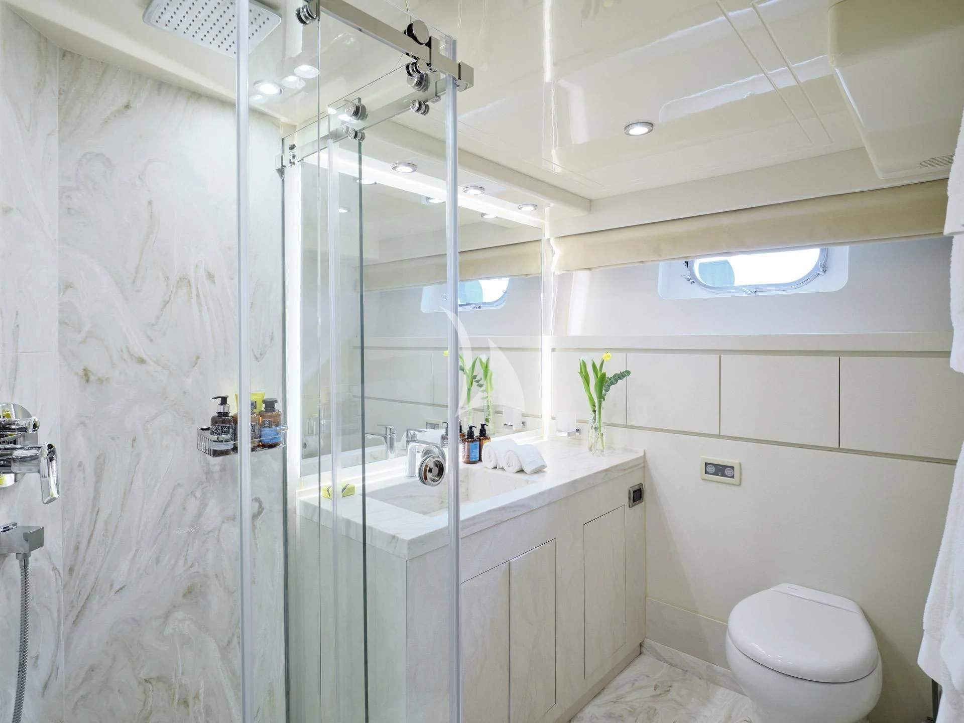 a bathroom with a glass shower aboard MANTRA Yacht for Sale