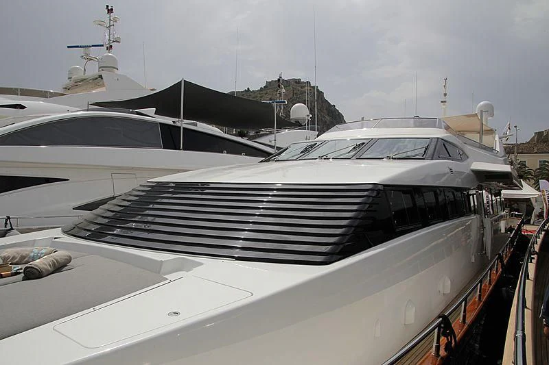 a white yacht with a red railing aboard MANTRA Yacht for Sale