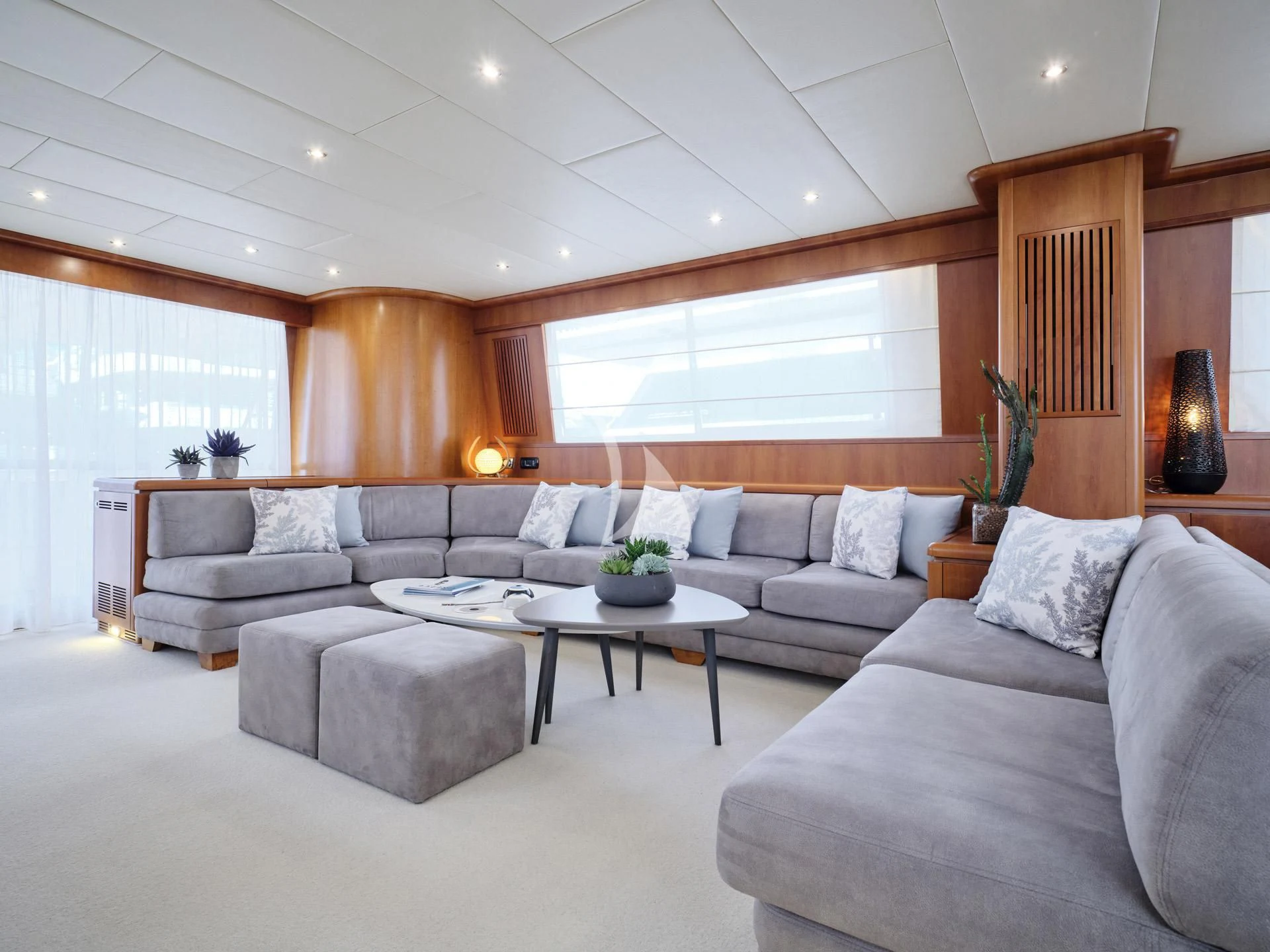 a living room with a couch and a coffee table aboard MANTRA Yacht for Sale