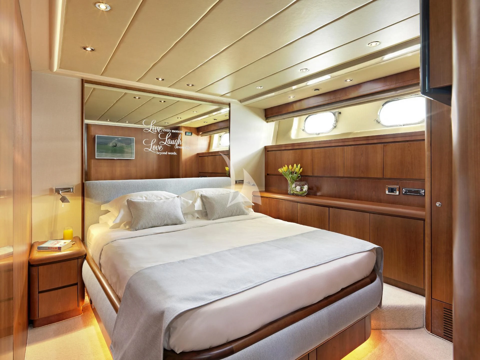 a bed in a room aboard MANTRA Yacht for Sale