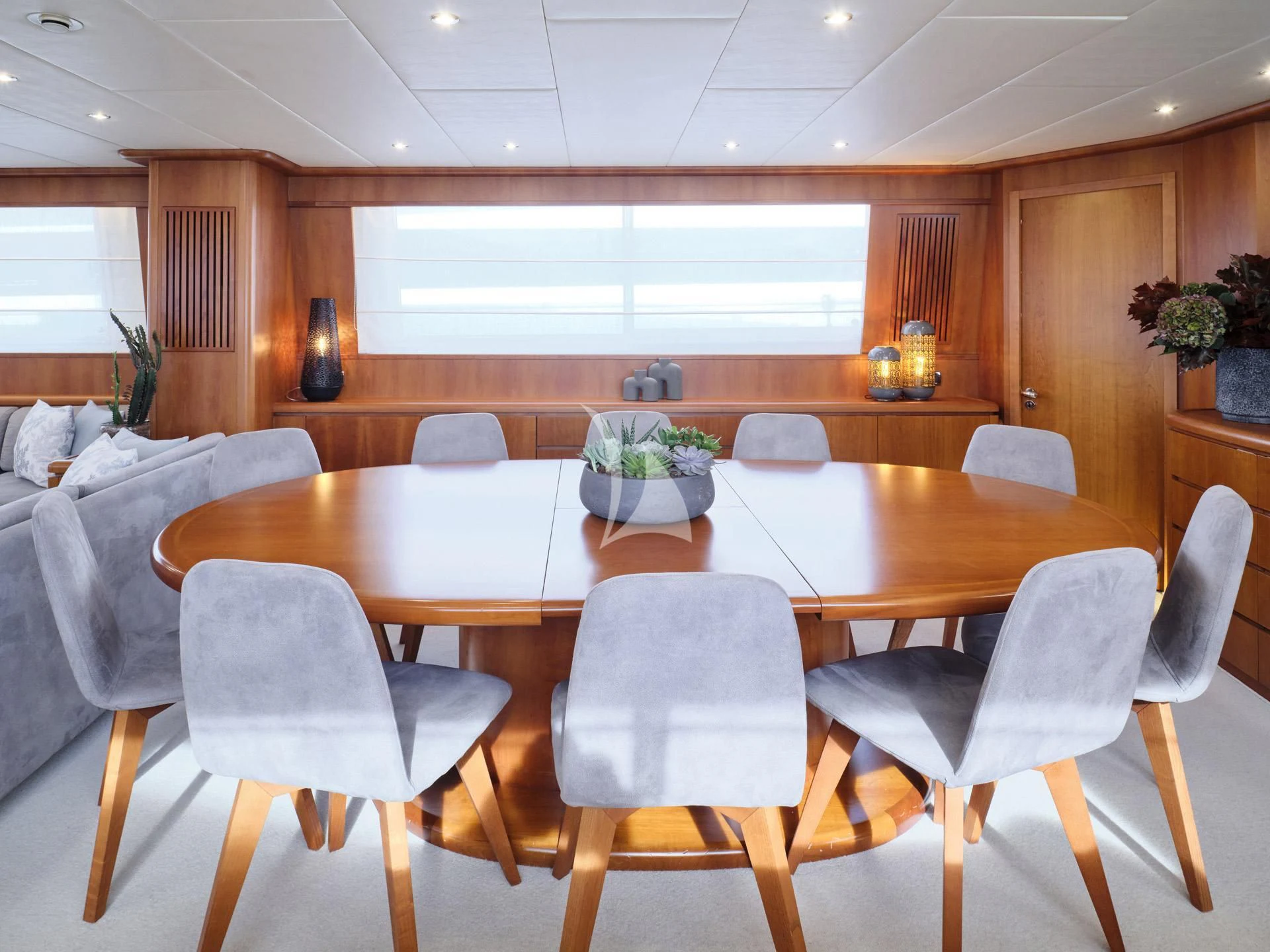a dining table in a room aboard MANTRA Yacht for Sale