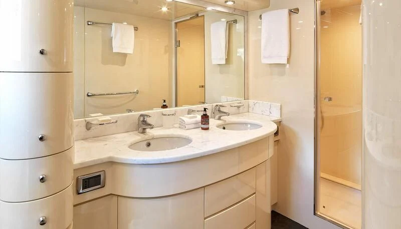 a bathroom with a sink and a mirror aboard MANTRA Yacht for Sale