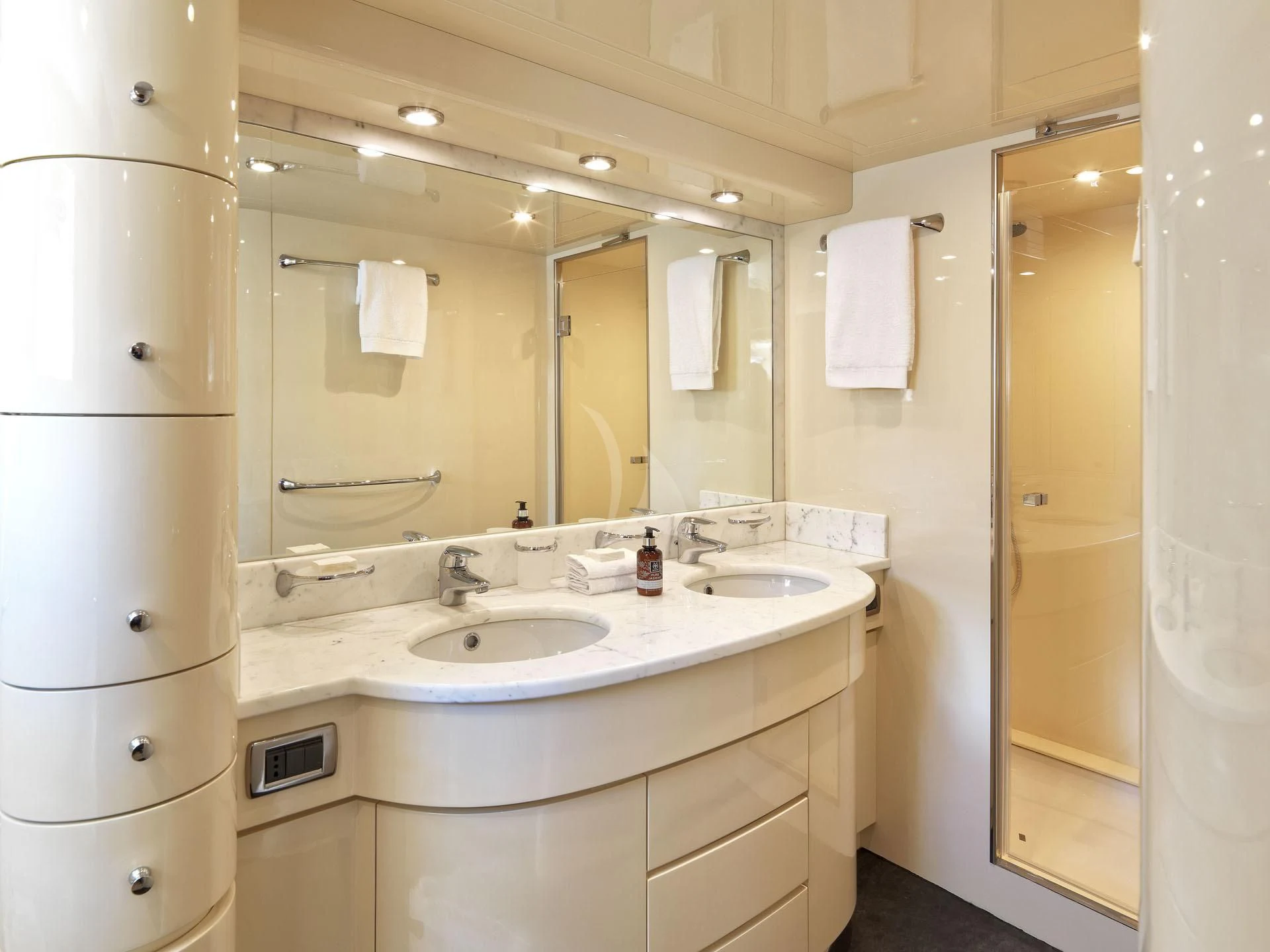 a bathroom with a large mirror aboard MANTRA Yacht for Sale