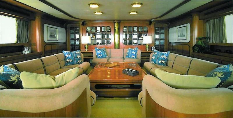a living room with couches and a coffee table aboard BLUE GOLD Yacht for Sale