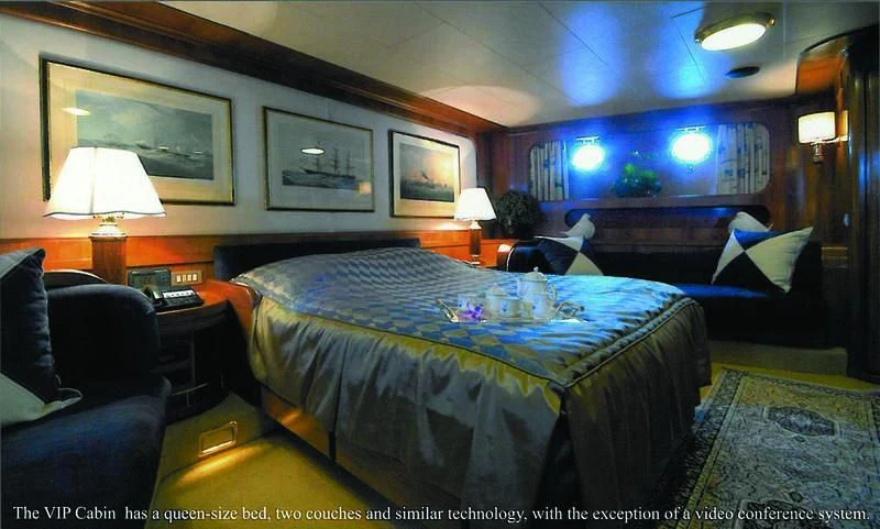 a bedroom with a bed and a couch aboard BLUE GOLD Yacht for Sale