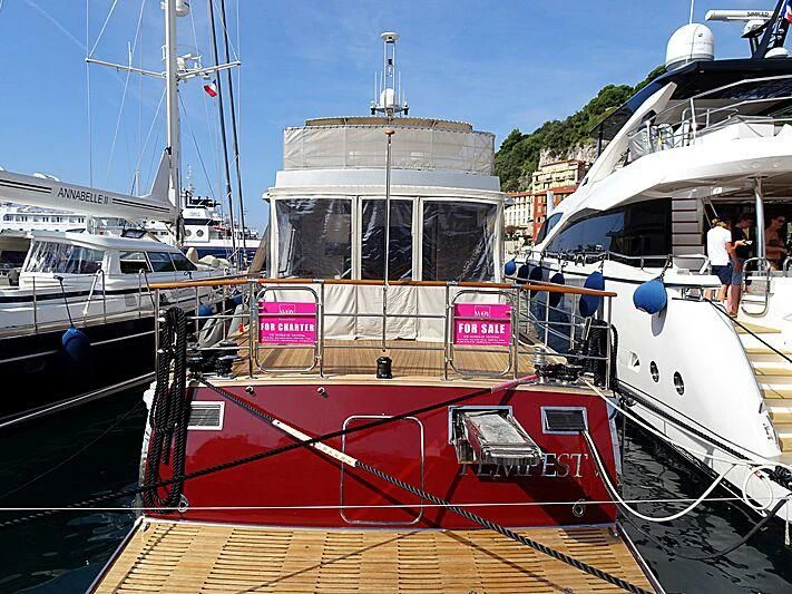 a boat is parked in the water aboard TEMPEST WS Yacht for Charter