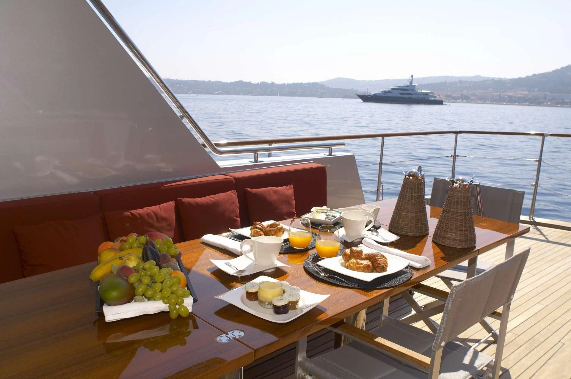 a table with food and drinks on it aboard TEMPEST WS Yacht for Charter