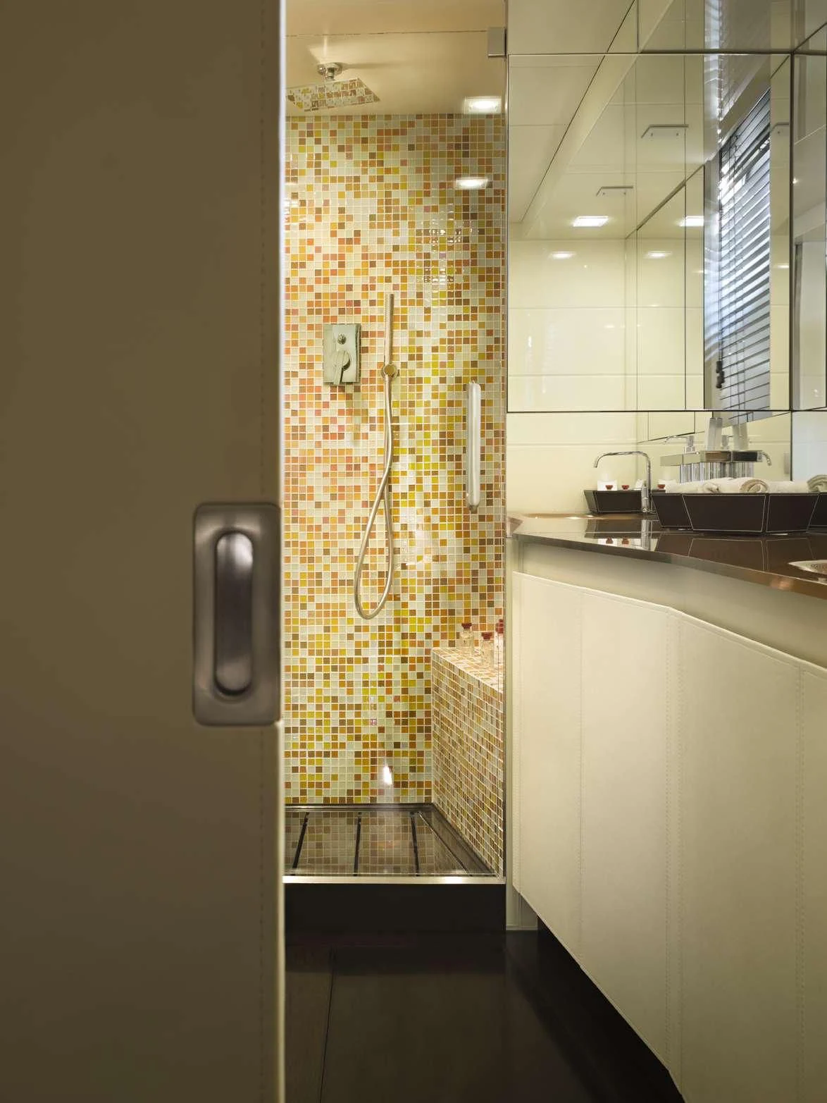 a bathroom with a sink and a mirror aboard TEMPEST WS Yacht for Charter