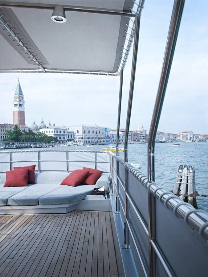 a balcony with pillows and a bed aboard TEMPEST WS Yacht for Charter