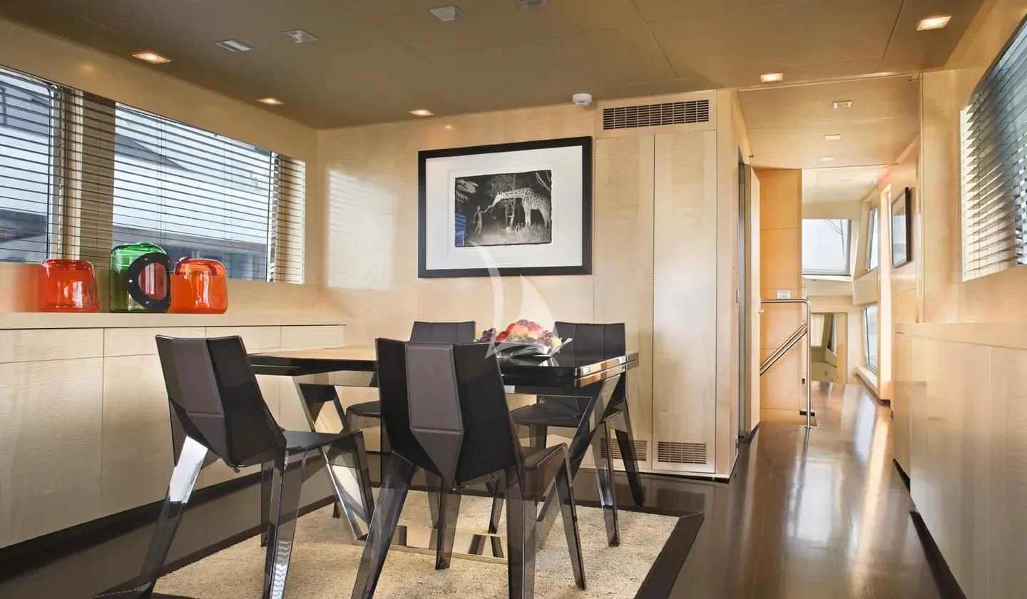 a room with a table and chairs aboard TEMPEST WS Yacht for Charter