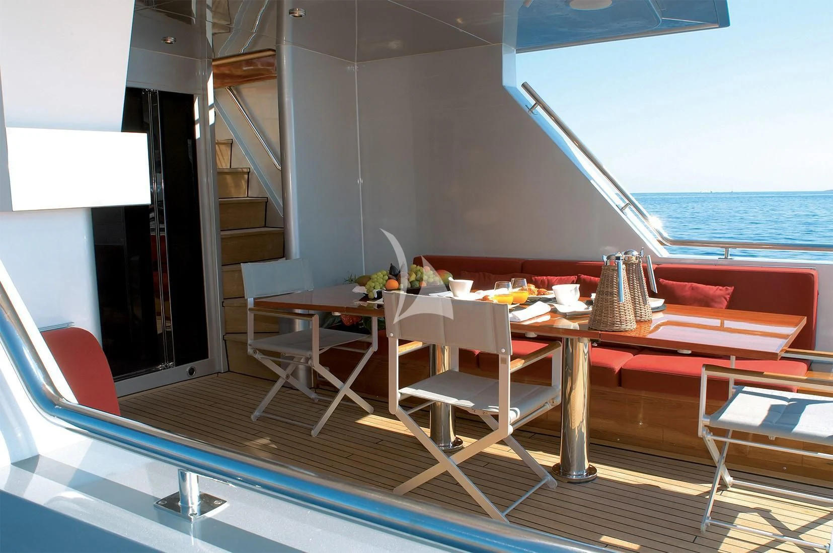 a room with a table and chairs aboard TEMPEST WS Yacht for Charter
