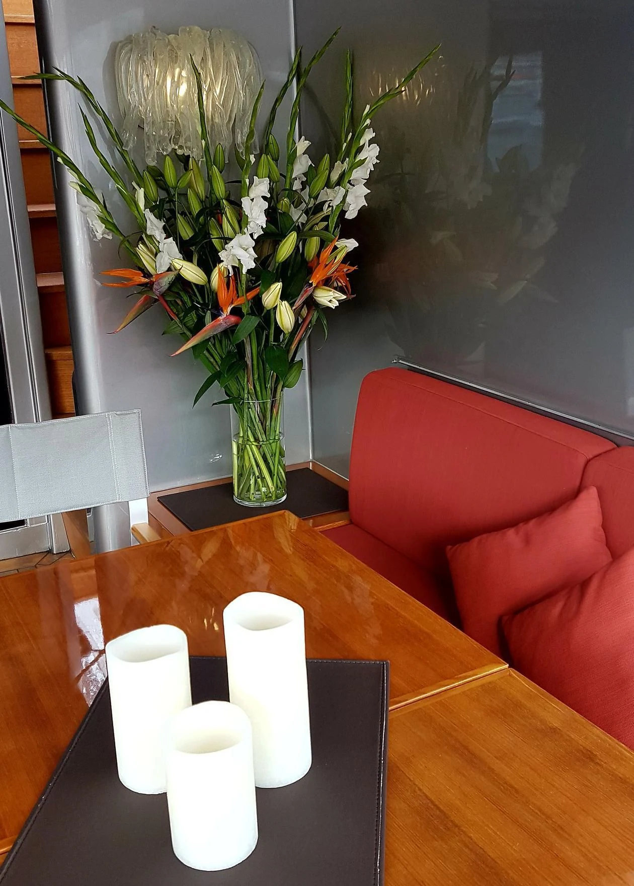 a vase of flowers on a table aboard TEMPEST WS Yacht for Charter