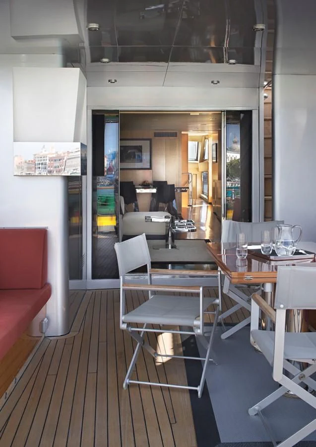 a restaurant with tables and chairs aboard TEMPEST WS Yacht for Charter