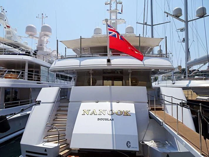 a boat with a flag on the front aboard TEMPO Yacht for Sale