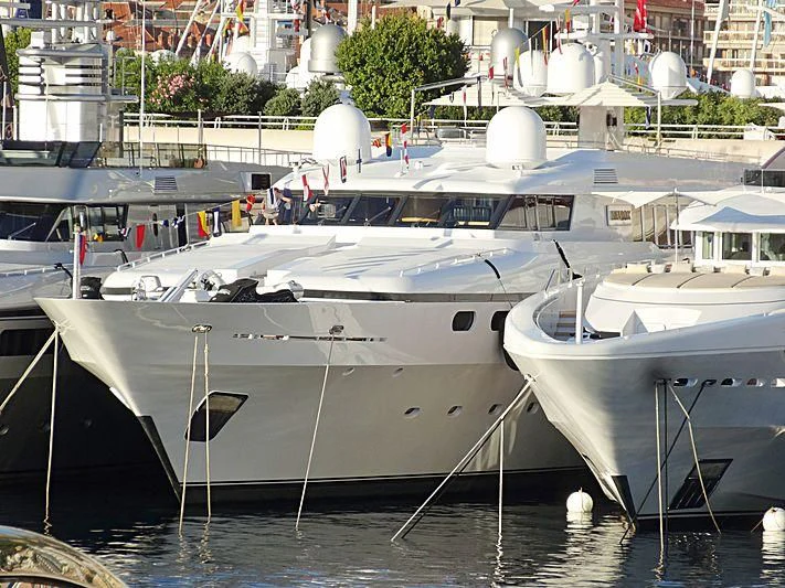 several boats are parked in a harbor aboard TEMPO Yacht for Sale