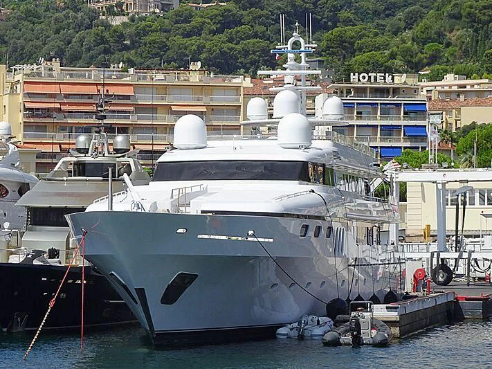 a large white boat docked aboard TEMPO Yacht for Sale