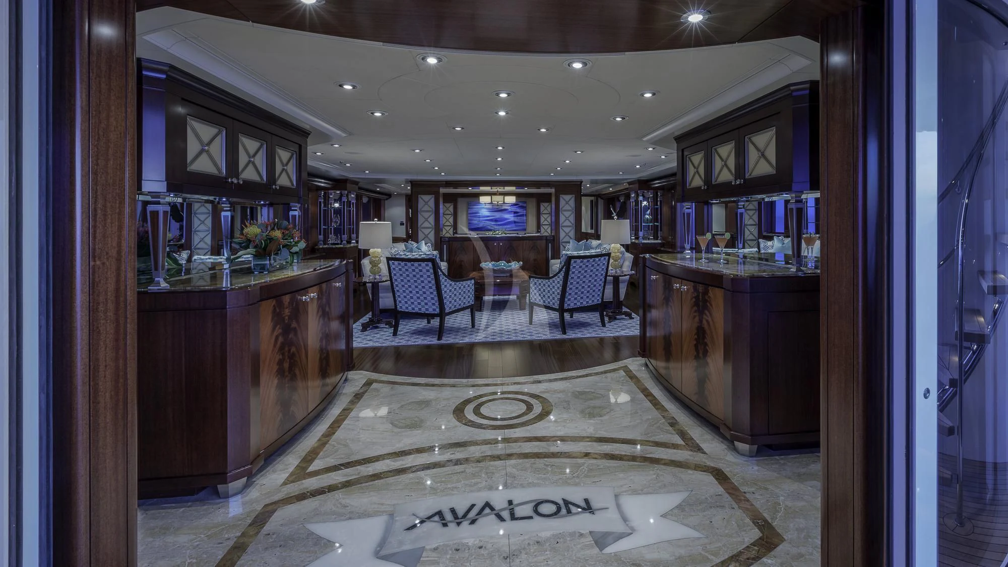 a room with a counter and chairs aboard AVALON Yacht for Sale