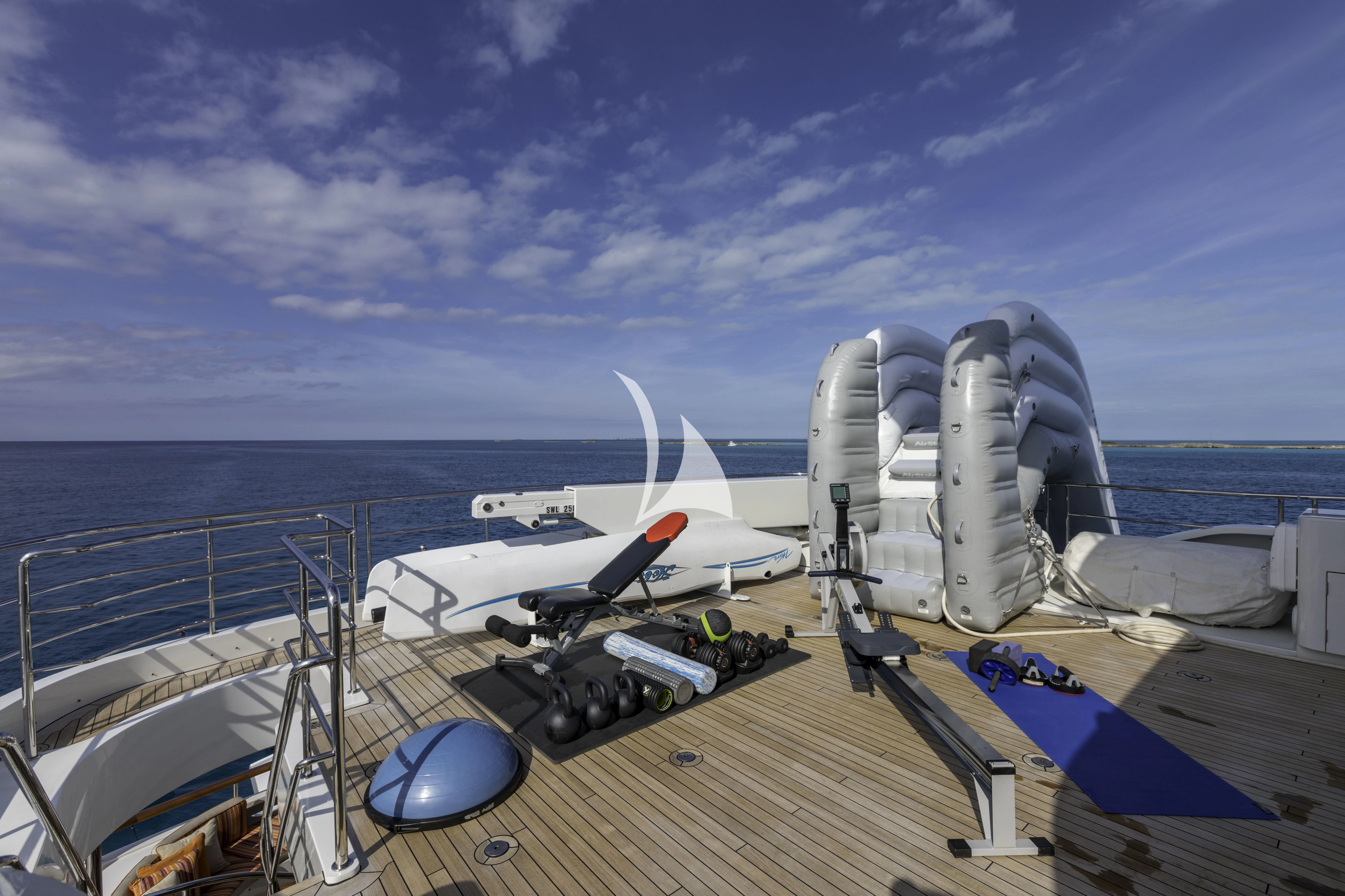 a deck with a large satellite dish on it and a body of water in the background aboard AVALON Yacht for Sale