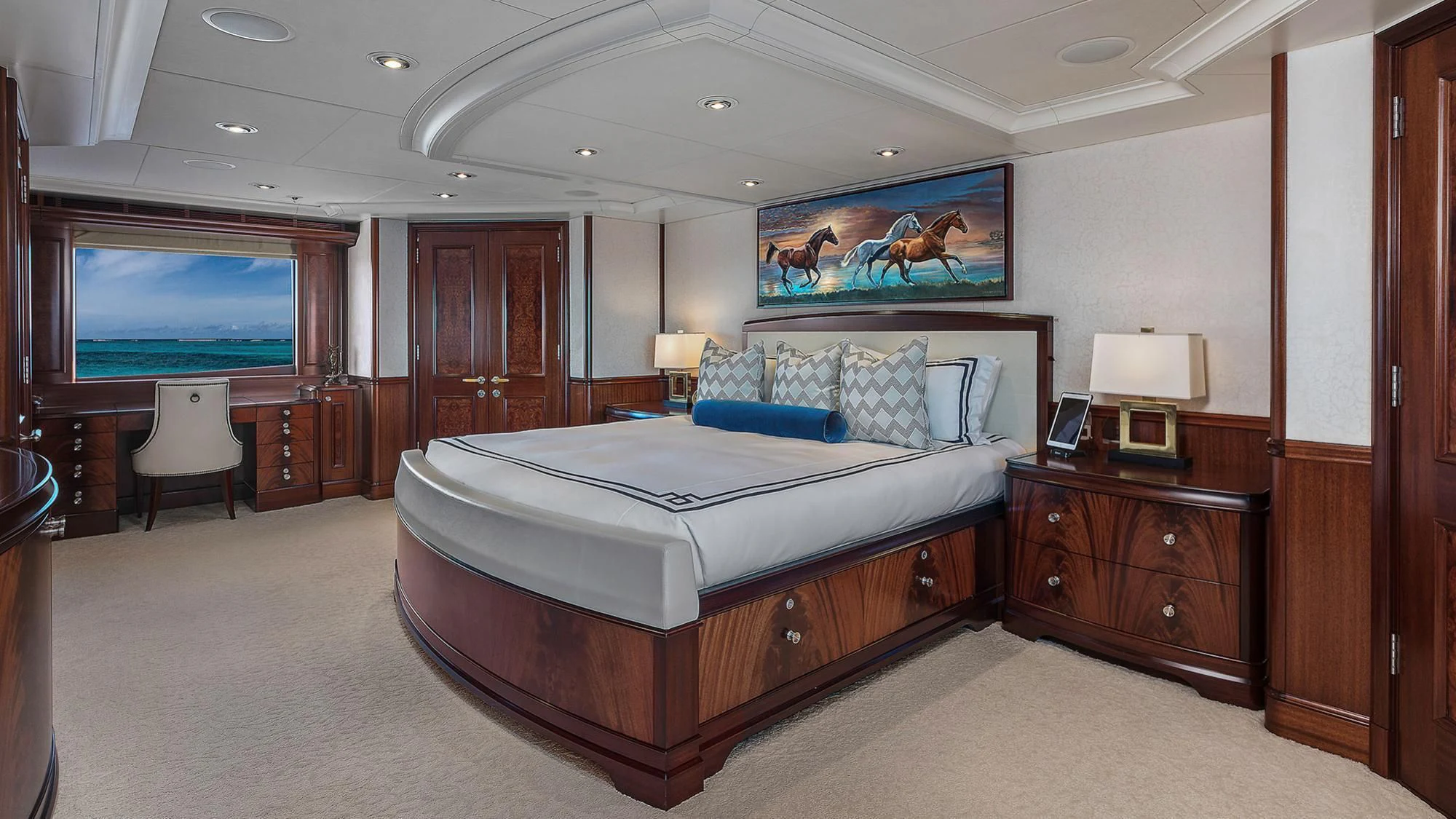 a bedroom with a bed and a television aboard AVALON Yacht for Sale