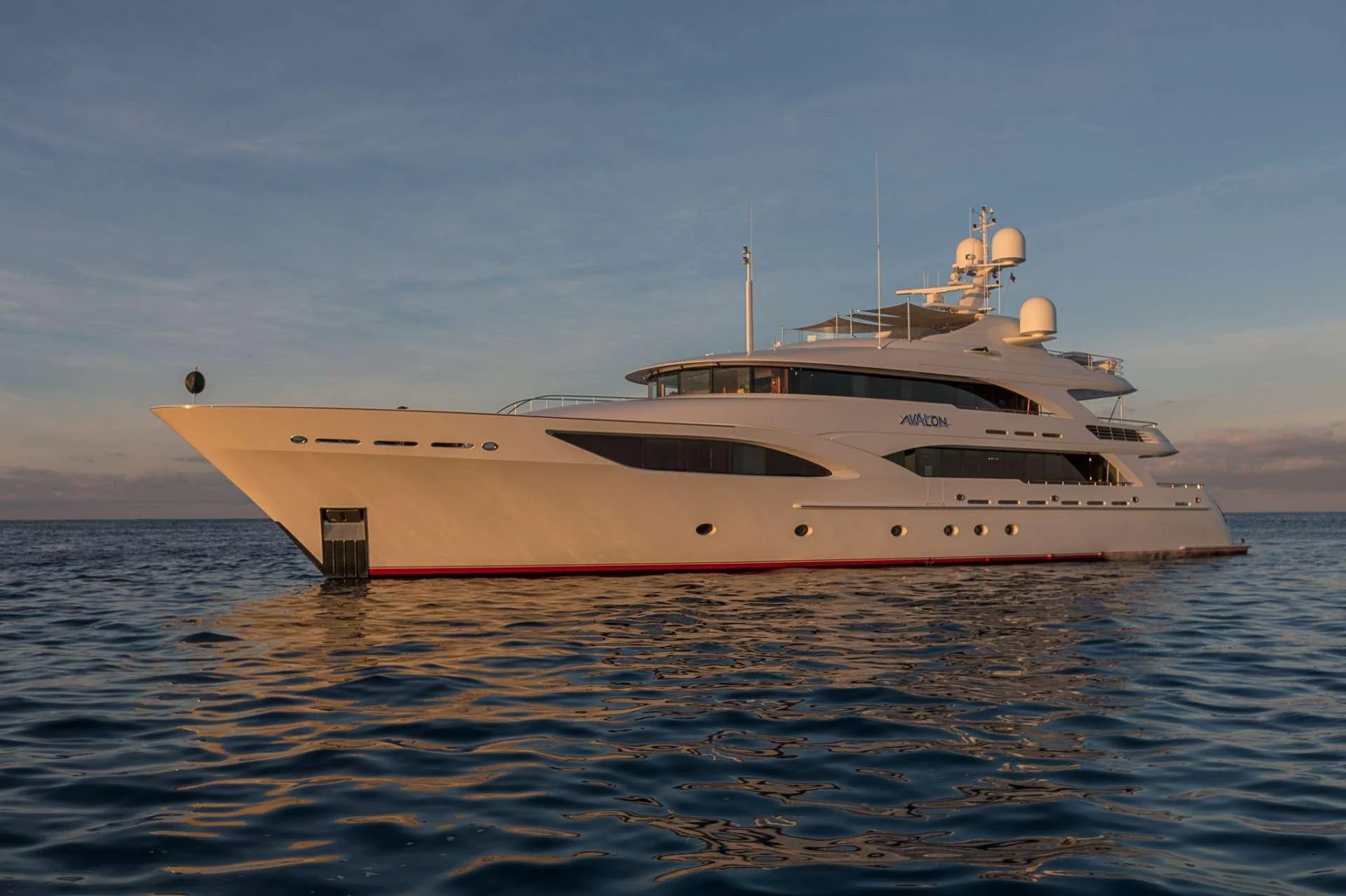 a large white ship in the water aboard AVALON Yacht for Sale